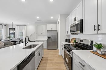Designer finishes including quartz counters and stainless-steel appliances